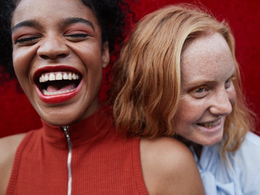 Two women smiling and laughing