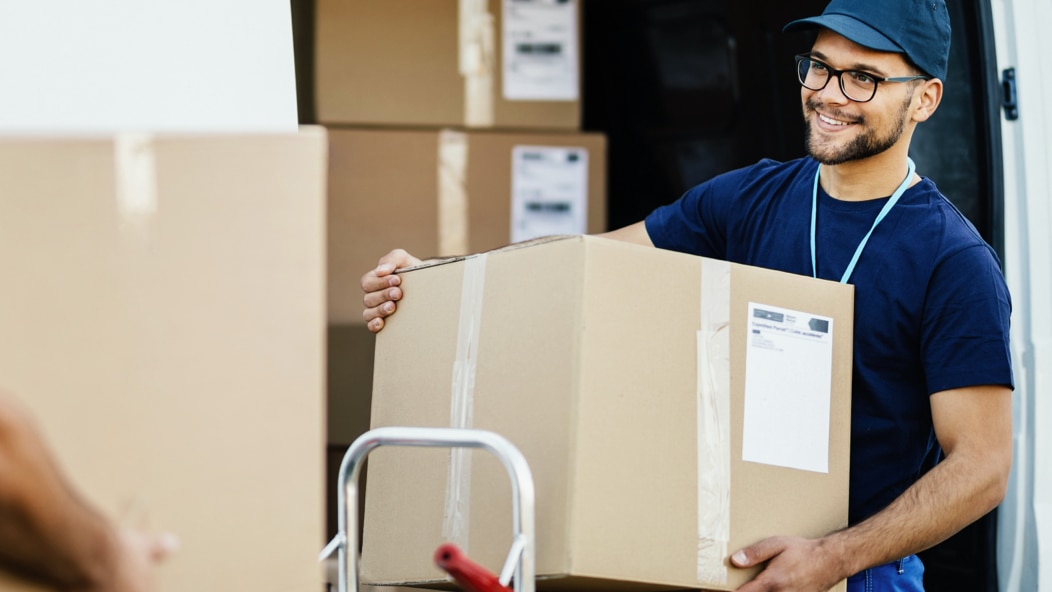 One of Vanguard’s goals is to identify and engage capable, diverse suppliers, like this person carrying a box.